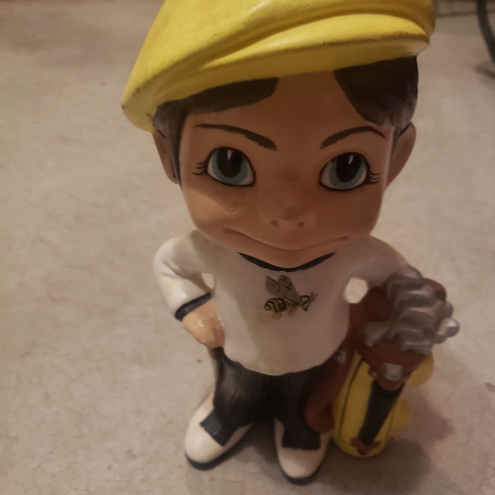 Caddy boy ceramic figurine